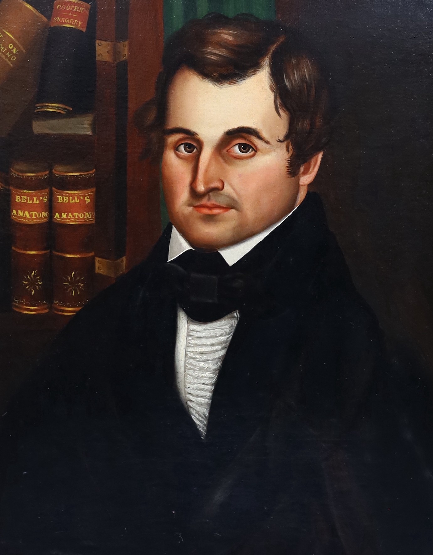 19th century American School, Portrait of Charles Burgess, seated beside a copy of bells anatomy and other medical works, oil on canvas laid on board, 65 x 52cm